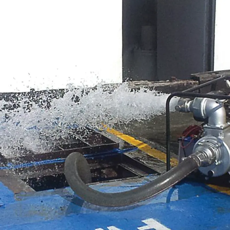 A pump delivering a strong stream of water into a vessel hold